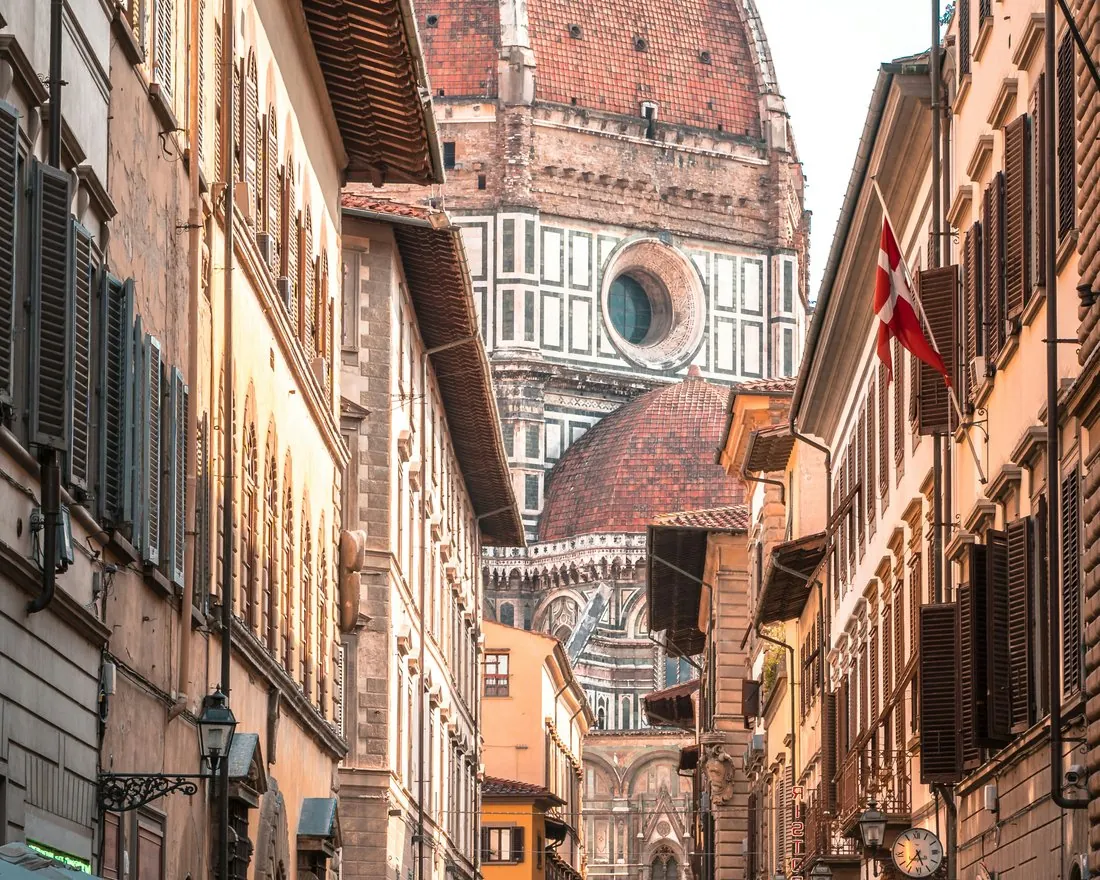 A Florentine street opening onto the dome of the Duomo.